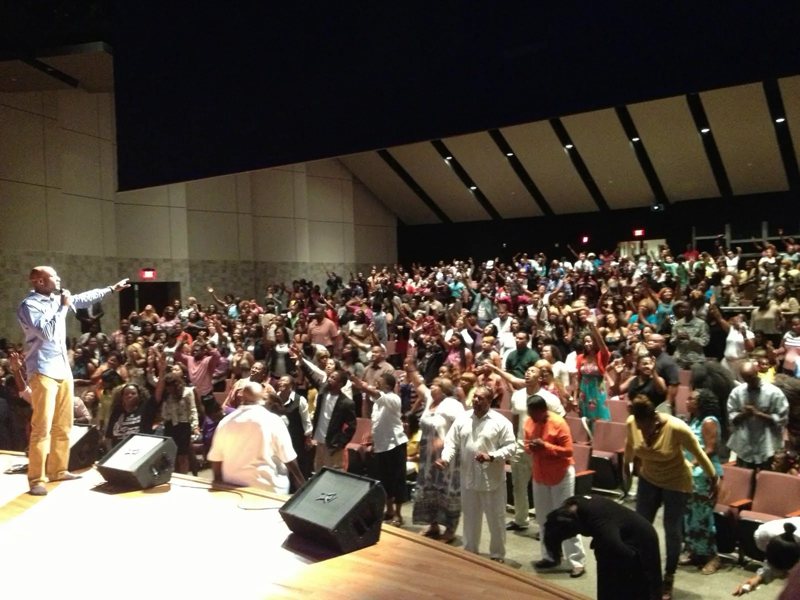 Pastor Keion Henderson preaching to the congregation in worship, 2009
